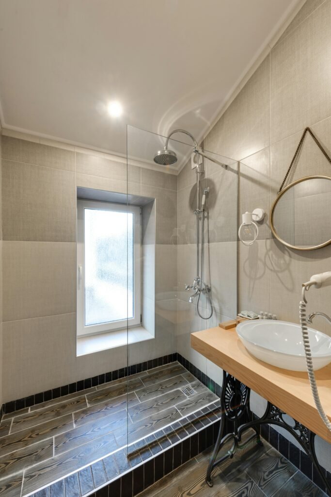 pexels-photo-7746552-7746552 Elegant bathroom design featuring a modern glass shower and stylish fixtures.